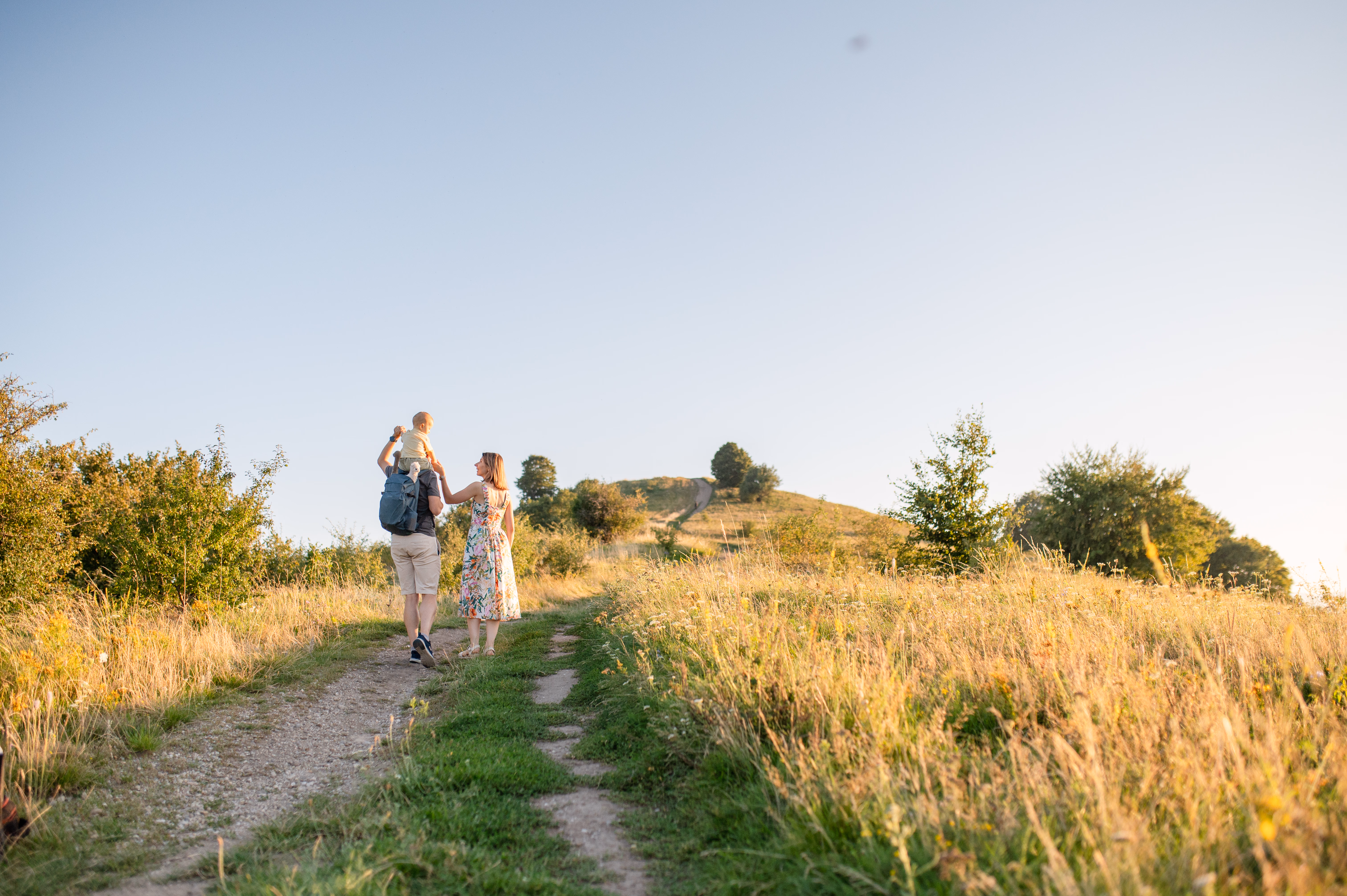 The whole family walking on a path