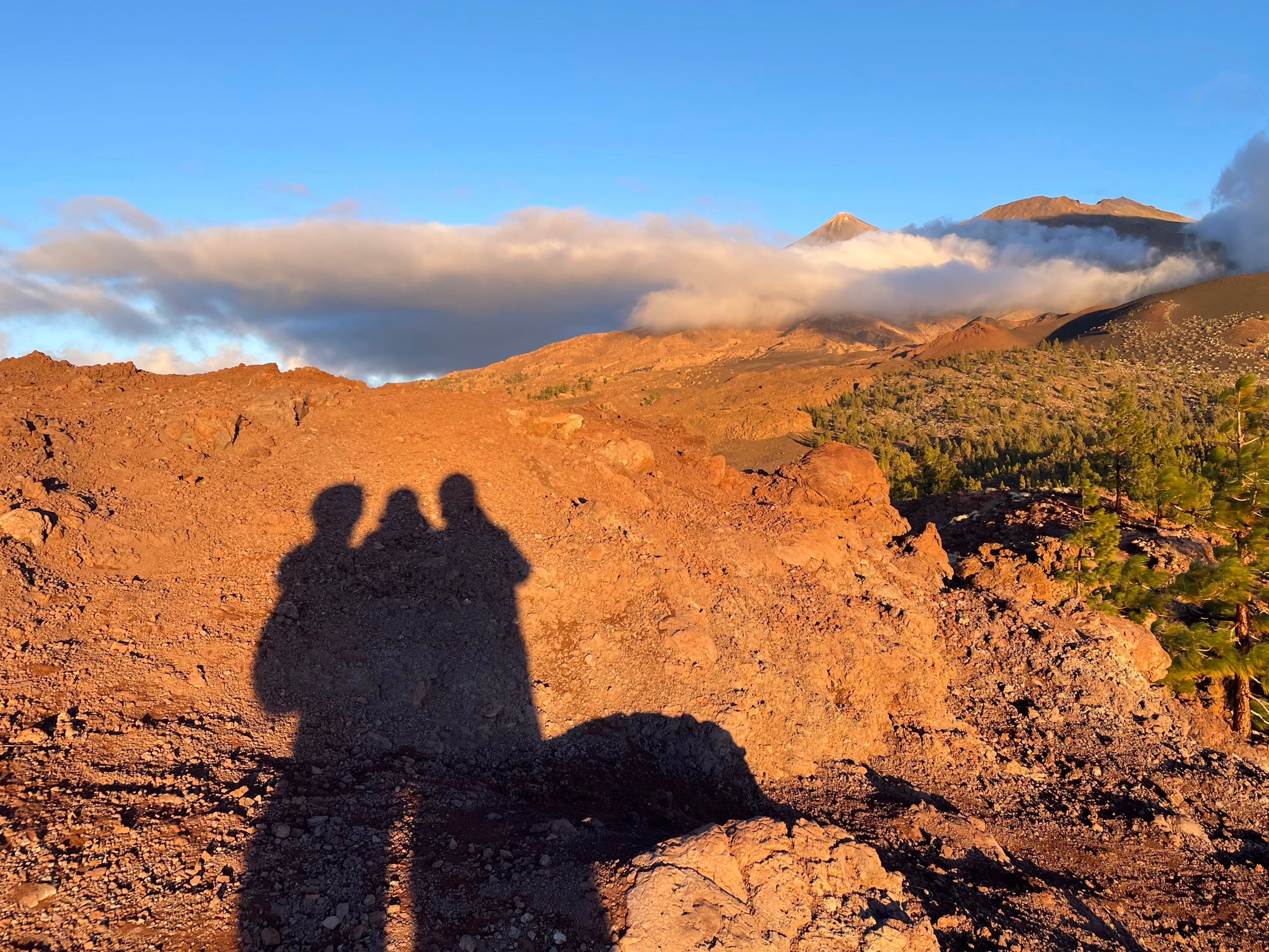 Our shadows projected on a rock during sunset on Tenerife island