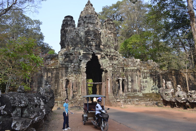A tuk-tuk at one of the gates of Angkor Thom